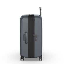 Load image into Gallery viewer, Side panel view of the suitcase showing the expandable feature expanded. 
