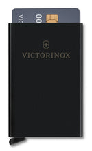Load image into Gallery viewer, Front Panel View of the card case showing one credit card in ejected position. The victorinox logo is printed in a light gray. 
