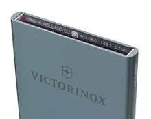 Load image into Gallery viewer, Angled top panel view of the card case. On the inside the printed text reads: Made in Holland-EU, a QR code, AD | 060 - 1421 - 27 NN. 
