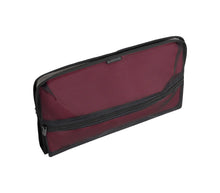 Load image into Gallery viewer, Angled view of the burgundy organizer pack included with the suitcase. 
