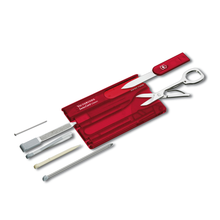 Load image into Gallery viewer, The red swiss card with the included tools arranged outside their compartments. 

