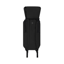 Load image into Gallery viewer, The black backpack partially folded into its own for convenient storage.
