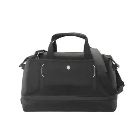 Front panel view of the black duffle bag with the shoulder strap hanging from the right side. 