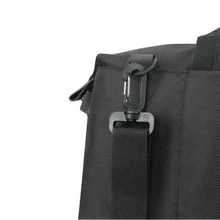 Load image into Gallery viewer, Close up to the duffle bag&#39;s shoulder strap clip, which can be used to attach and detach to the bag. 

