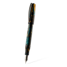 Load image into Gallery viewer, The Visconti Homo Sapiens Earth Origins Fountain Pen with the cap posted. The pen and cap are made of blue, yellow and dark brown swirls of lacquer, and feature metal trims. 
