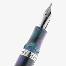 Load image into Gallery viewer, Close up to the fountain pen grip section and nib. It has a metal sing with the words HOMO SAPIENS engraved. The nib has engraved a decoration with the word VISCONTI in the mimddle, followed by 18kt 750, and then the nib point M.
