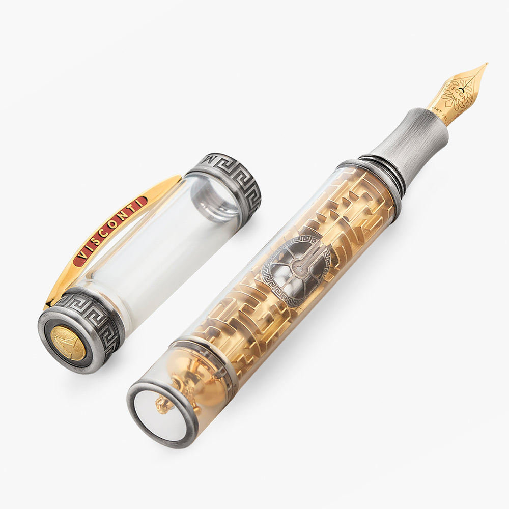 Fountain pen with transparent body and metallic accents on a white background.