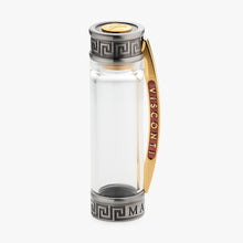 Load image into Gallery viewer, Clear cap with gold and silver accents on a white background.
