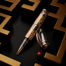 Load image into Gallery viewer, Luxury rollerball pen with intricate design on a dark surface with gold geometric patterns.
