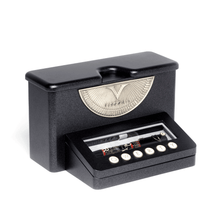 Load image into Gallery viewer, Angled view of the presentation case. It is in the shape of a typewriter, and has the Q W E R T Y keys placed as small medals at the front. 
