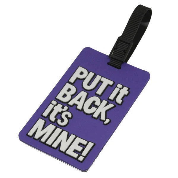 Angled Front view of the purple luggage tag with white text and a black strap. It reads: Put it BACK, it's MINE!