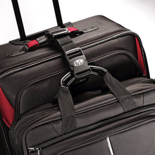Load image into Gallery viewer, Close up to the strap attaching a suitcase and briefcase together by the handles. 
