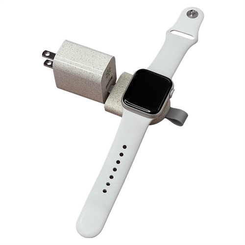 A white USB-C Apple Watch wireless dock attached to a USB wall plug.