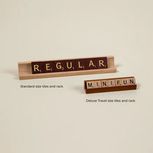 Load image into Gallery viewer, Size comparison of the standard and deluxe travel Scrabble game tiles and tile holder.
