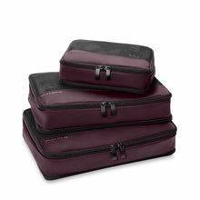 Load image into Gallery viewer, Set of three different sized purple packing cubes with black zippers and mesh fabric, stacked on a white background
