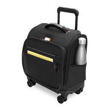 Load image into Gallery viewer, Angled front view of the black underseat cabin spinner. A water bottle and thin yellow book are tucked in the side and front compartments.
