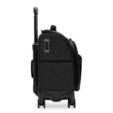 Load image into Gallery viewer, Side panel view of the black underseat cabin spinner. It features an embossing tag and open pocket .
