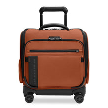 Load image into Gallery viewer, Front panel view of the canyon orange underseat spinner suitcase with black accents. It features two zipper-closing pockets and a grip handle at the top.
