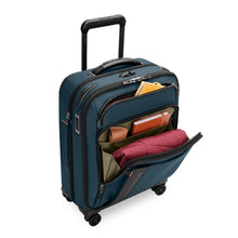 Load image into Gallery viewer, full angled view of the front compartments open of the ocean Briggs &amp; Riley Global 21" Carry-on Expandable Spinner
