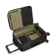 Load image into Gallery viewer, Angled interior view of the black suitcase. It features zipper-closing pockets and a panel to hold the contents of the main compartment.
