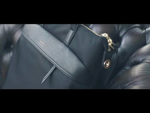 Load and play video in Gallery viewer, Review of the tote backpack, featuring it&#39;s spacious interior, front pockets, laptop compartment, and 2-in-one ease of use.
