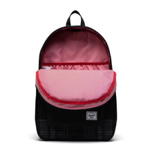 Load image into Gallery viewer, Front view of the black grayscale plaid backpack with the main compartment unzipped. The interior lining is a pattern of red and white vertical lines.
