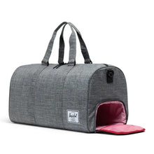 Load image into Gallery viewer, Angled view of the raven crosshatch duffle bag. The side panel's shoe compartment is opened.
