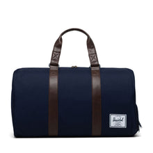 Load image into Gallery viewer, Front view of the peacoat chicory coffee duffle bag.
