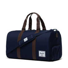 Load image into Gallery viewer, Angled view of the peacoat chicory coffee duffle bag. 
