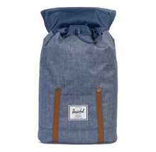 Load image into Gallery viewer, Front view of the Dark Chambray Crosshatch Retreat backpack. The top flap is tilted back. 
