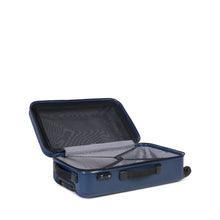 Load image into Gallery viewer, Angled interior view of the navy Trade suitcase. It features zipper-closing panel dividers and adjustable straps.

