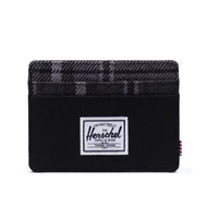 The black and grayscale plaid wallet.