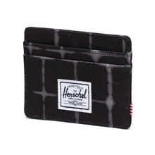 Load image into Gallery viewer, Angled front view of the Te Dye Grid Charlie Wallet. 
