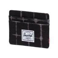 Angled front view of the Te Dye Grid Charlie Wallet. 