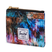 Load image into Gallery viewer, Angled view of the summer tie-dye Herschel RFID Oscar Wallet with a zippered main compartment and external card slots.
