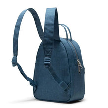 Load image into Gallery viewer, Angled back panel view of the copen blue mini backpack with the shoulder straps extended up.
