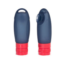 Load image into Gallery viewer, Two navy blue travel bottles with red caps on a white background.

