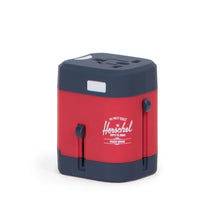Load image into Gallery viewer, Angled front view of the navy and red travel adapter with white Herschel logo printed on the side.
