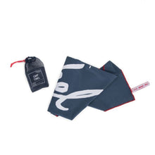 Load image into Gallery viewer, The navy camp towel and the storage pouch on a white background.
