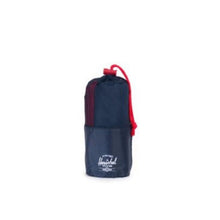 Load image into Gallery viewer, The navy blue camp towel rolled and stored inside its matching pouch.
