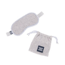 Load image into Gallery viewer, A heathered grey Herschel Supply Co. cashmere eye mask with a stretch-fit headband and a matching storage pouch on a white background.

