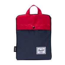 Load image into Gallery viewer, The Navy Red packable duffle folded into its pocket.
