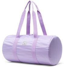 Load image into Gallery viewer, Angled front view of the Lavendula packable duffle with the shoulder straps pulled up.
