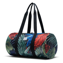 Load image into Gallery viewer, Angled front view of the Watercolor duffle bag with the black shoulder straps pulled up.
