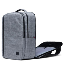 Load image into Gallery viewer, The Raven Crosshatch backpack with the back panel compartment unzipped. 
