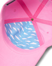 Load image into Gallery viewer, Angled interior view of the pink Maggie Simpson cap with a partial inner lining of sky blue fabric with white clouds

