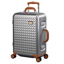 Load image into Gallery viewer, Angled front view of the silver colored suitcase with tan accents. 
