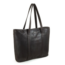 Load image into Gallery viewer, Angled front view of the brown leather tote bag with the shoulder straps pulled up.
