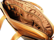 Load image into Gallery viewer, Interior view of the tan leather portfolio. It features pen and cellphone compartments, along with a zipper-closing pocket.
