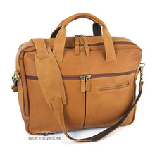 Load image into Gallery viewer, Front panel view of the tan leather brief. The removable shoulder strap is resting across the front and top panels. 
